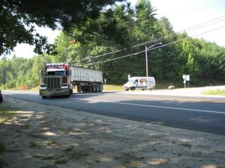 An 18-wheeled truck turns left onto NH Route 3A in Hooksett